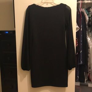Black Alexia Admor dress with sheer long sleeves